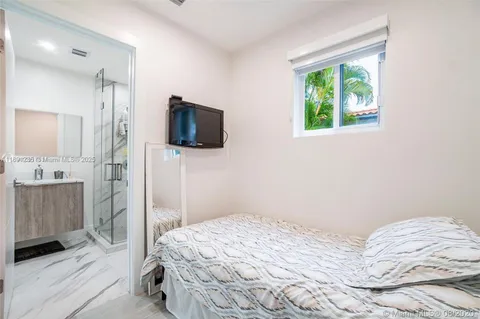 a bathroom with a granite countertop sink a shower and a mirror