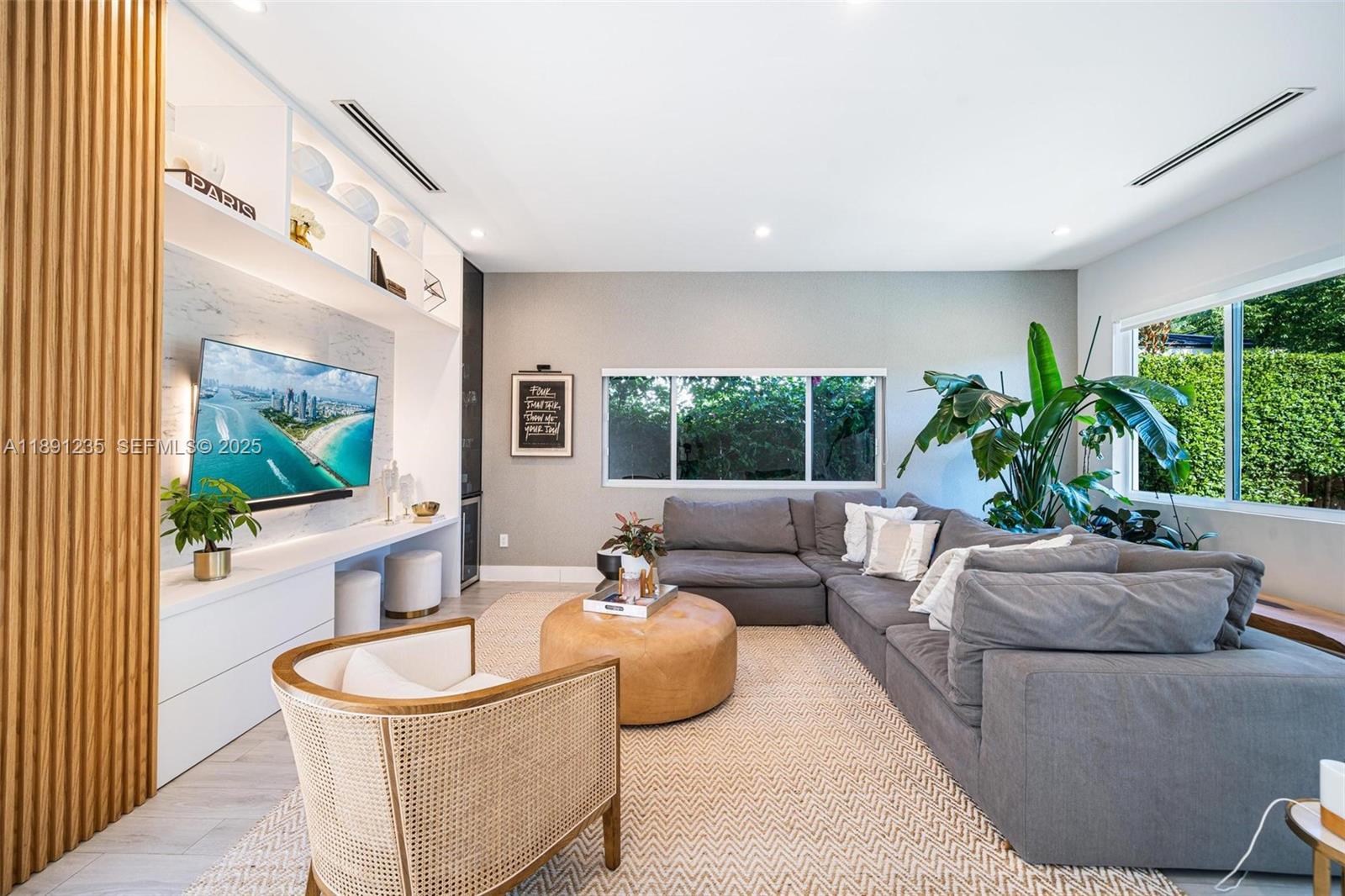 2437 Southwest 25th Terrace Miami, FL 33133 - Photo 4 of 32 a living room with furniture and a large window