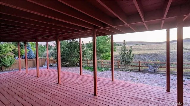 a view of a porch with wooden floor