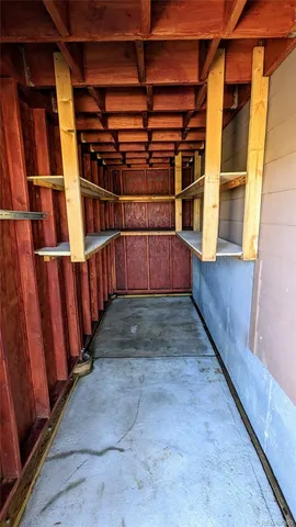 a view of deck with wooden floor and door