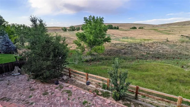 a view of a yard with an outdoor seating
