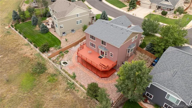 an aerial view of a house with a garden