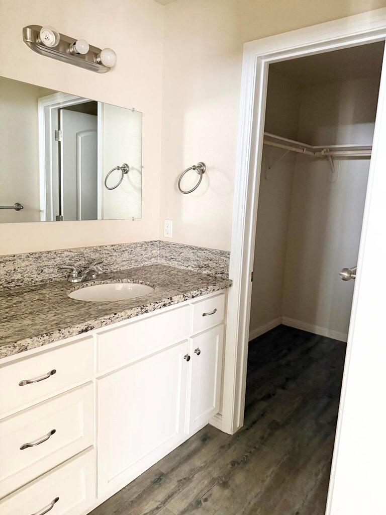 1310 North Belmont Road Exeter, CA 93221 - Photo 10 of 15 a view of kitchen island wooden floor and staircase
