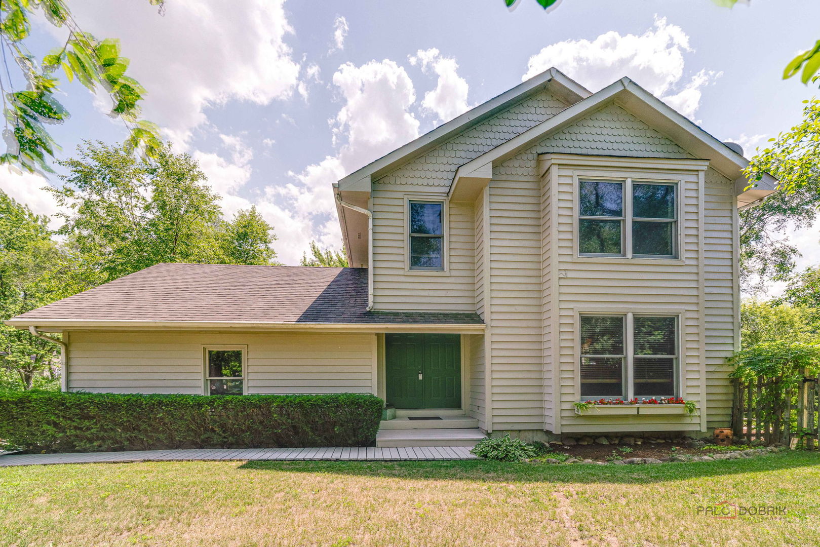 24 Hickory Road Oakwood Hills, IL 60013 - Photo 1 of 35 a front view of a house with a yard