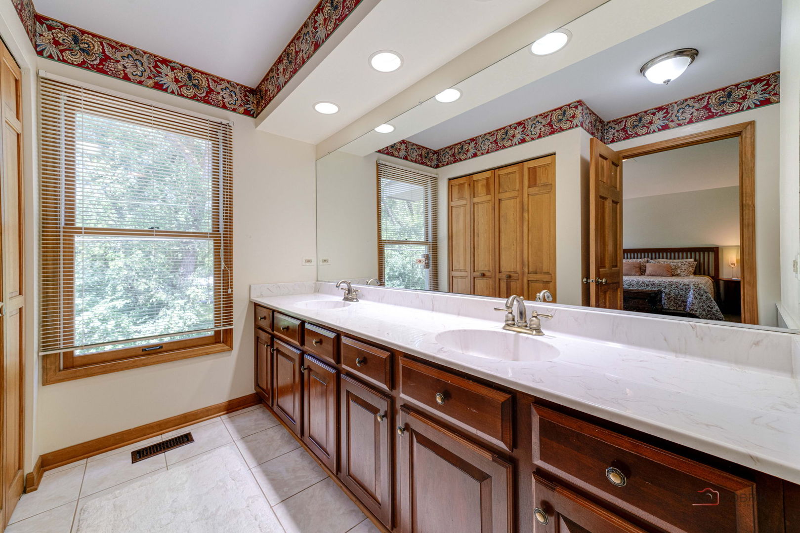 24 Hickory Road Oakwood Hills, IL 60013 - Photo 15 of 35 a spacious bathroom with a granite countertop sink and a large mirror