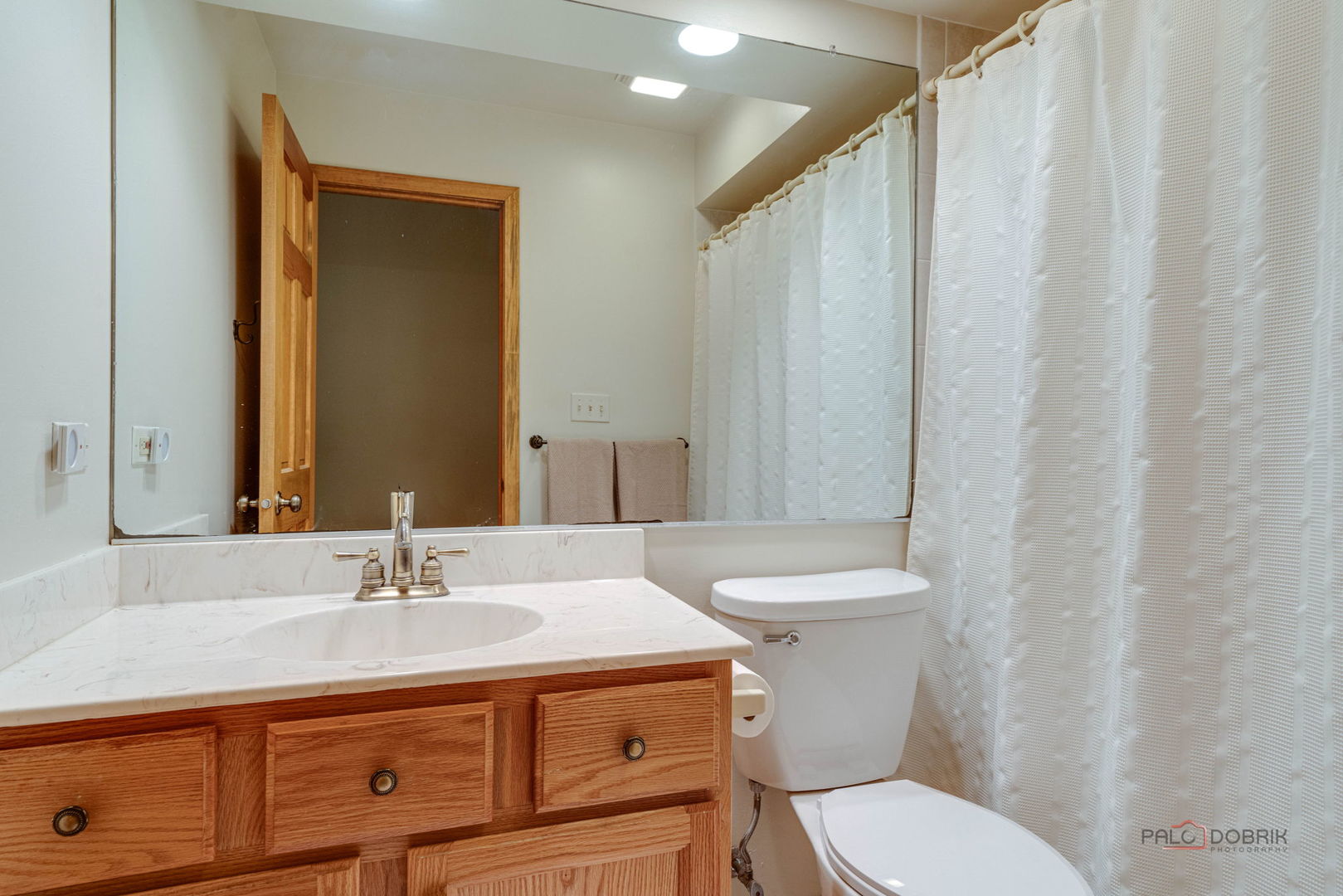 24 Hickory Road Oakwood Hills, IL 60013 - Photo 18 of 35 a bathroom with a sink a toilet and shower curtain