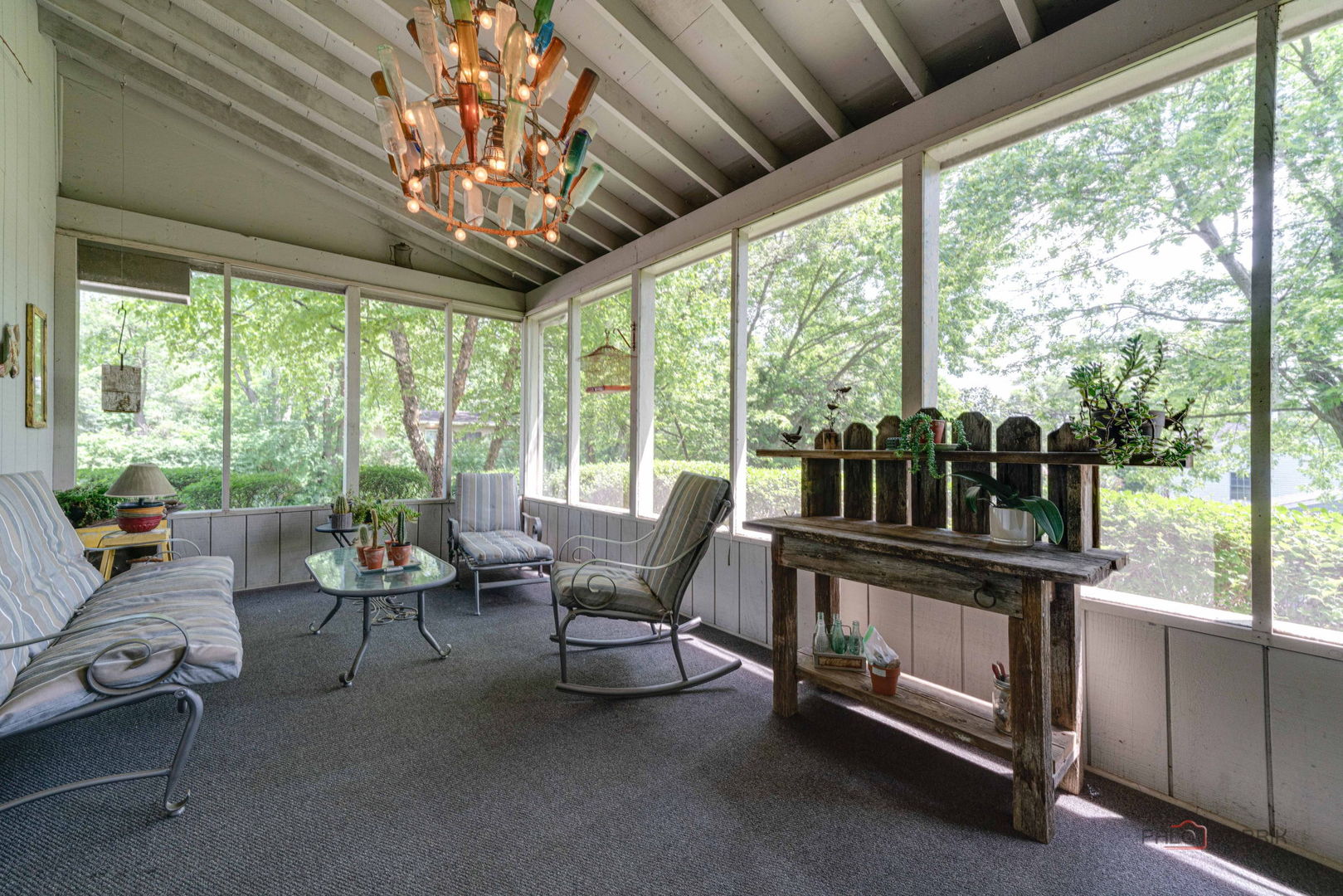24 Hickory Road Oakwood Hills, IL 60013 - Photo 25 of 35 a living room with furniture and a floor to ceiling window