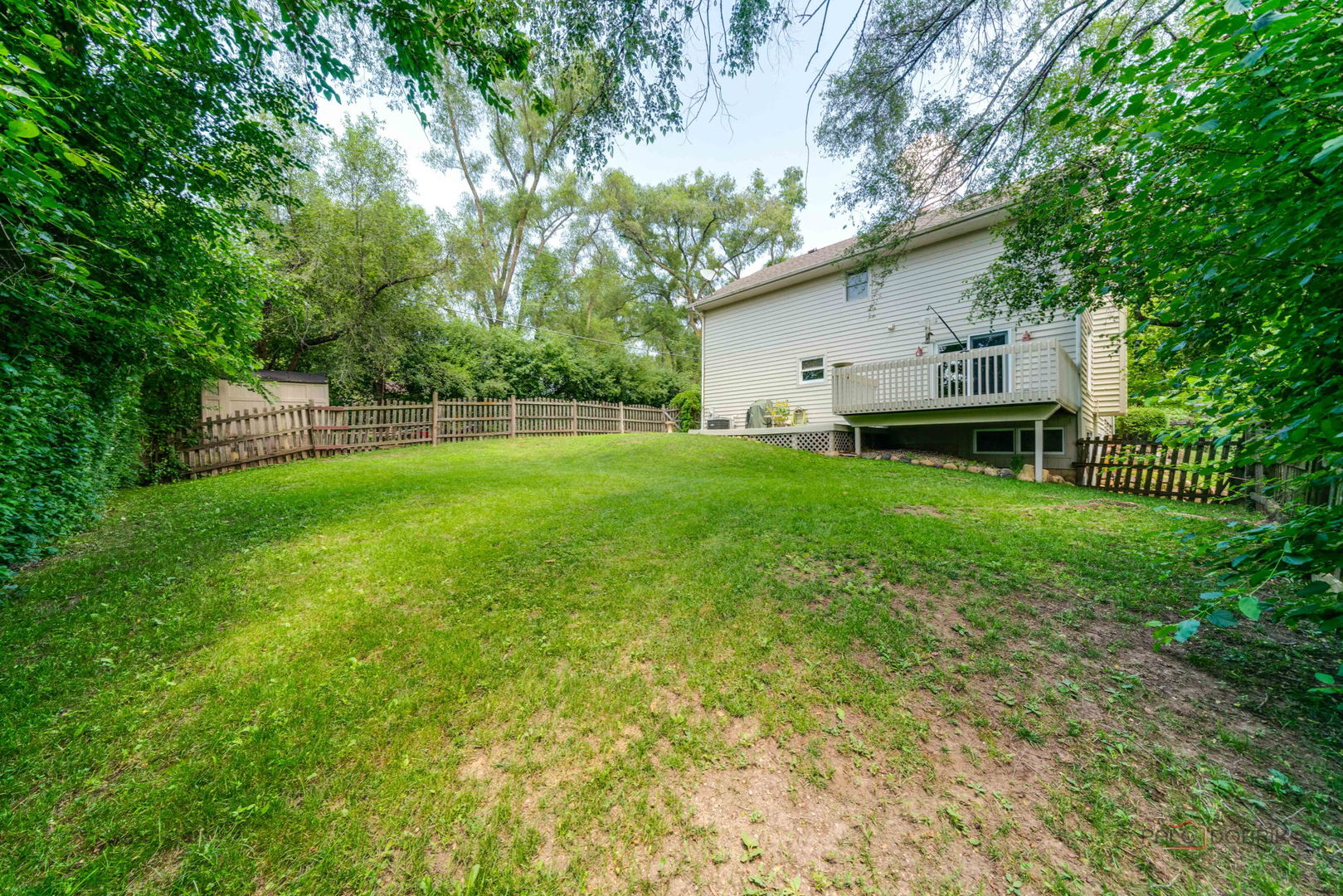 24 Hickory Road Oakwood Hills, IL 60013 - Photo 32 of 35 a backyard of a house with table and chairs
