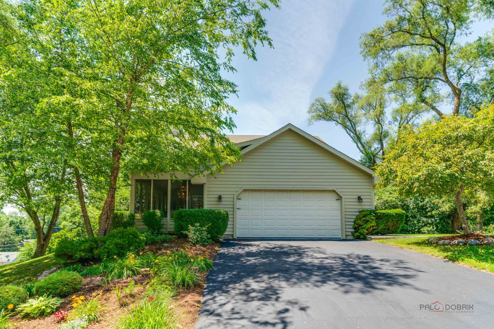 24 Hickory Road Oakwood Hills, IL 60013 - Photo 35 of 35 a view of a house with a yard and potted plants