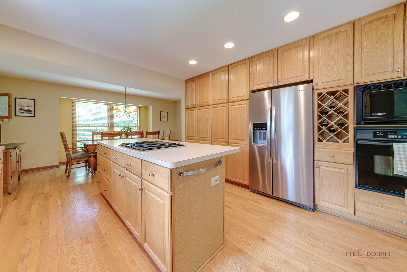 24 Hickory Road Oakwood Hills, IL 60013 - Photo 7 of 35 a kitchen with stainless steel appliances granite countertop a refrigerator a sink dishwasher a stove and a refrigerator with wooden floor