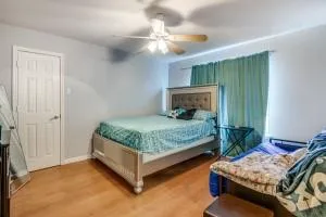 a bedroom with bed and window