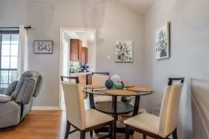 a dining room with furniture and window