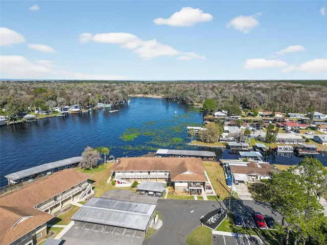 an aerial view of a house with a lake view