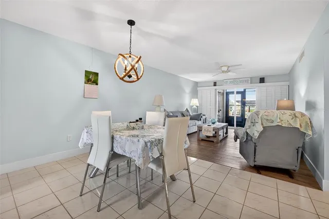 a kitchen with a refrigerator a sink a stove a microwave and cabinets