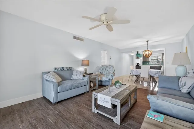 a kitchen with stainless steel appliances granite countertop a sink and a stove