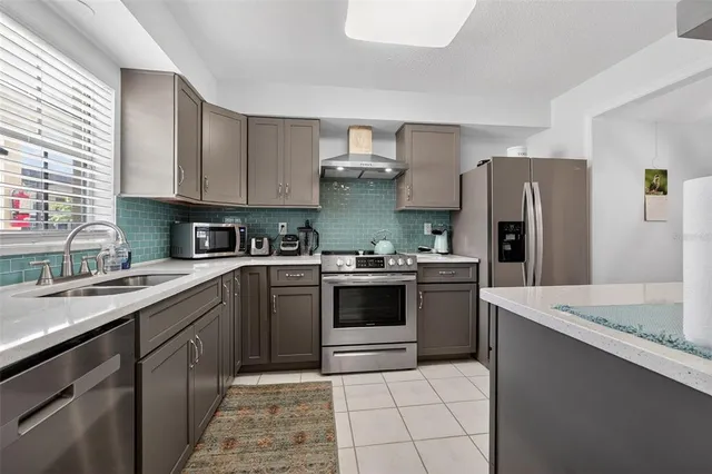 a kitchen with a sink and a window