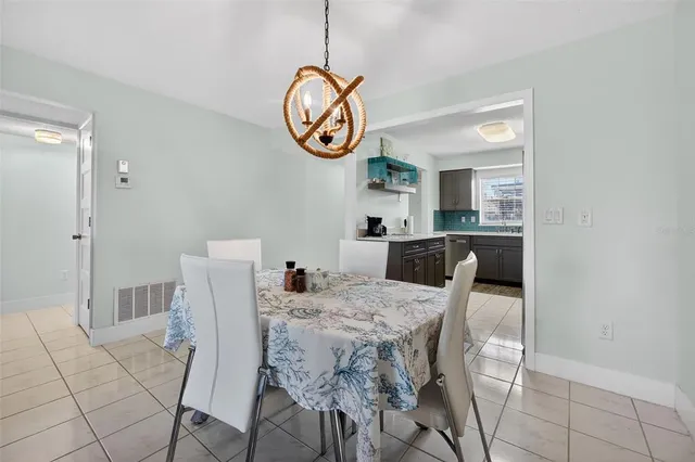 a spacious bedroom with a bed and ceiling fan