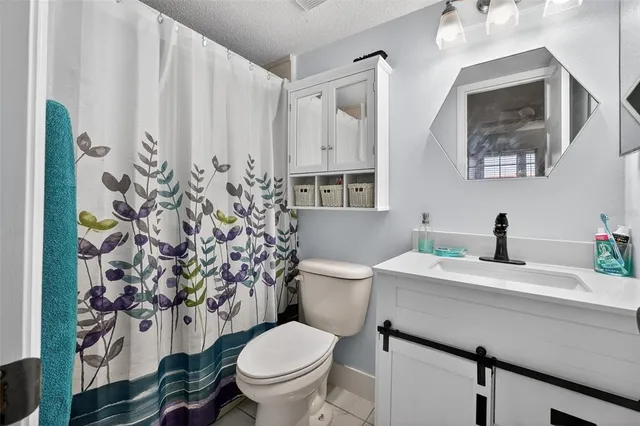 an aerial view of a house with a lake view