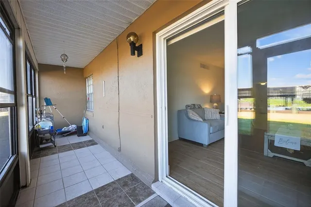 an aerial view of a house with a lake view