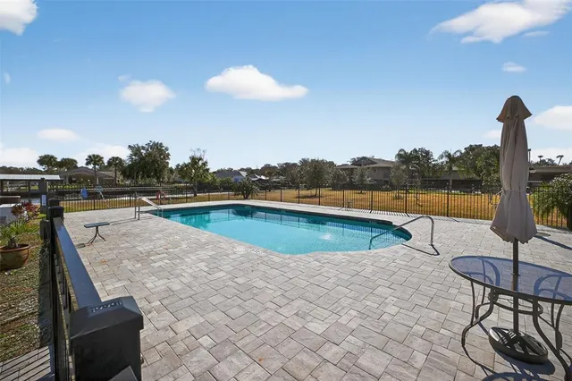 a view of a house with a yard and garage