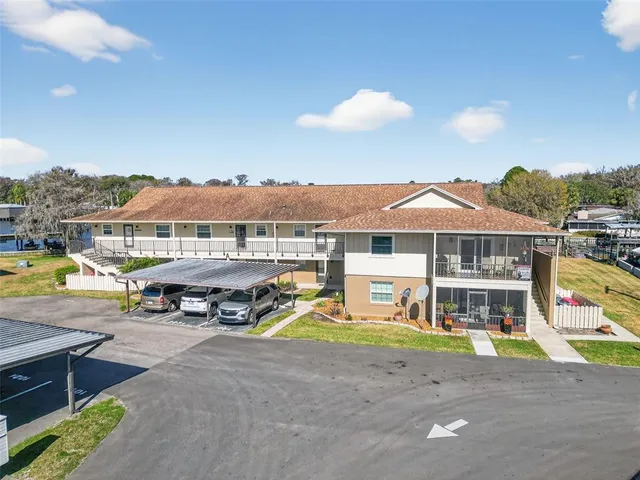 a view of a swimming pool and a yard
