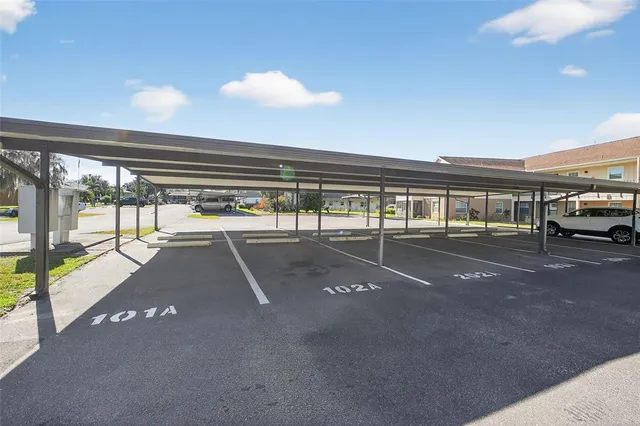 a view of a swimming pool with a yard