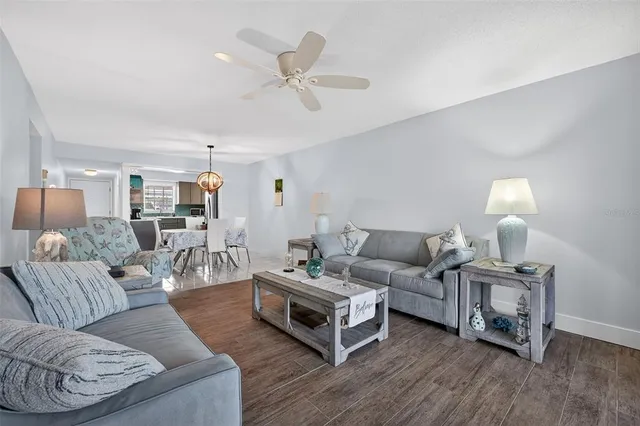 a kitchen with a sink a counter top space a stove and cabinets