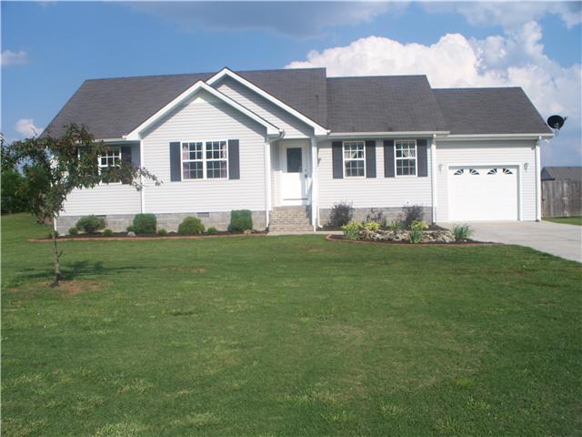 1554 Parker Road Manchester, TN 37355 - Photo 1 of 18 a front view of a house with a garden and yard