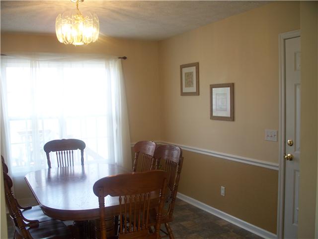 1554 Parker Road Manchester, TN 37355 - Photo 7 of 18 a view of a dining room with furniture and chandelier