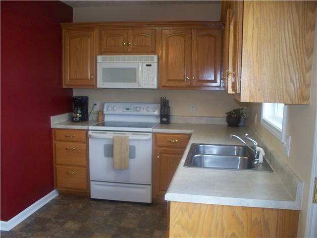 1554 Parker Road Manchester, TN 37355 - Photo 8 of 18 a kitchen with a sink stove and cabinets