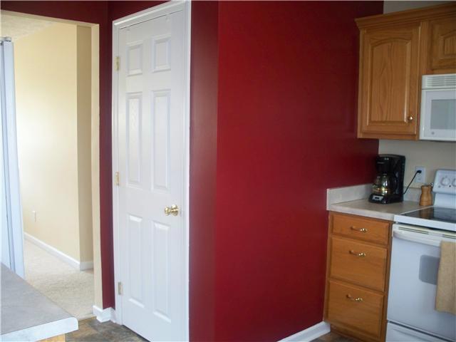 1554 Parker Road Manchester, TN 37355 - Photo 9 of 18 a kitchen with a refrigerator and cabinets