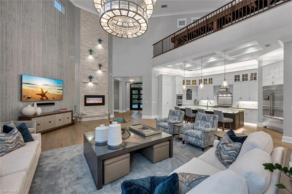 11910 Via Salerno Way Miromar Lakes, FL 33913 - Photo 12 of 50 a living room with furniture kitchen view and a large window