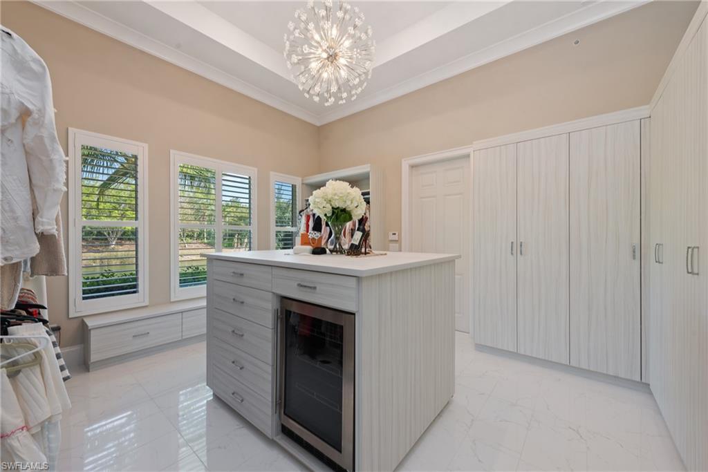 11910 Via Salerno Way Miromar Lakes, FL 33913 - Photo 19 of 50 a kitchen with stainless steel appliances granite countertop a stove and a sink