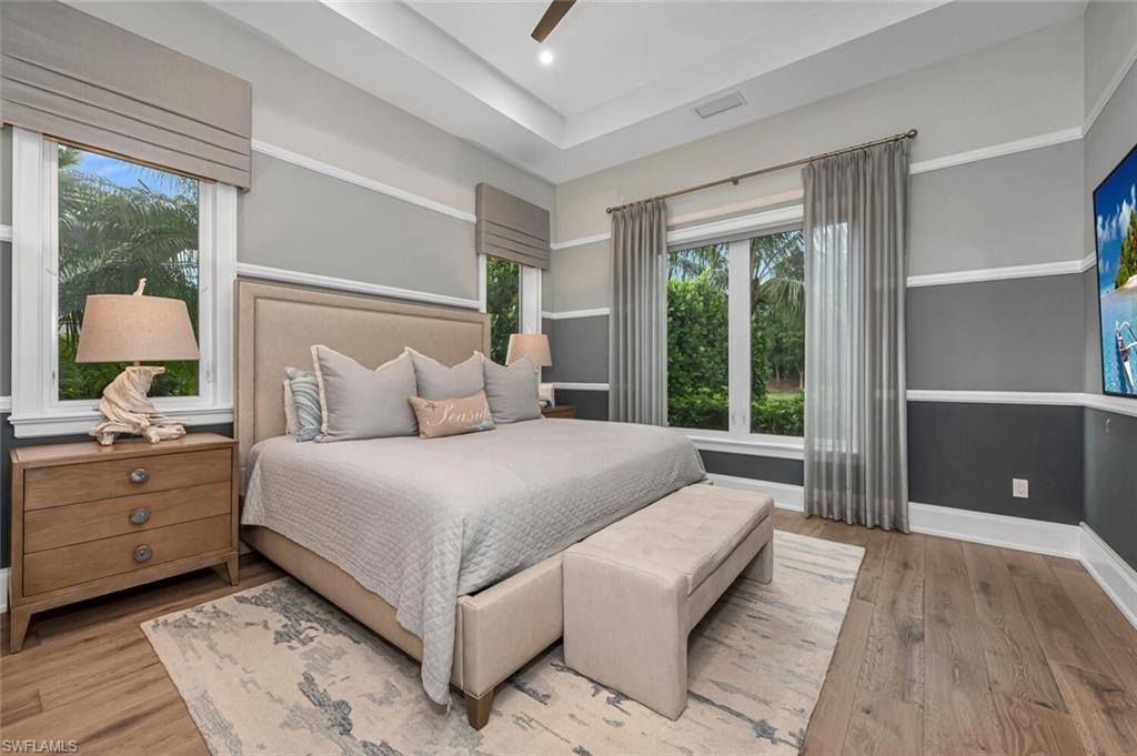 11910 Via Salerno Way Miromar Lakes, FL 33913 - Photo 20 of 50 a bedroom with a large bed and a window