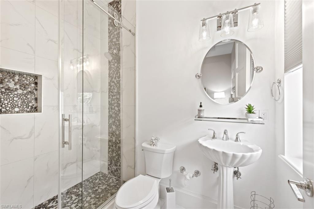 11910 Via Salerno Way Miromar Lakes, FL 33913 - Photo 24 of 50 a bathroom with a sink toilet and shower