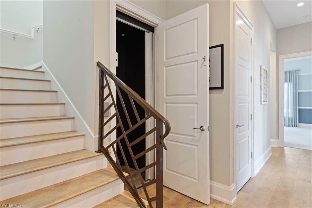 11910 Via Salerno Way Miromar Lakes, FL 33913 - Photo 26 of 50 a view of entryway with wooden floor and stairs