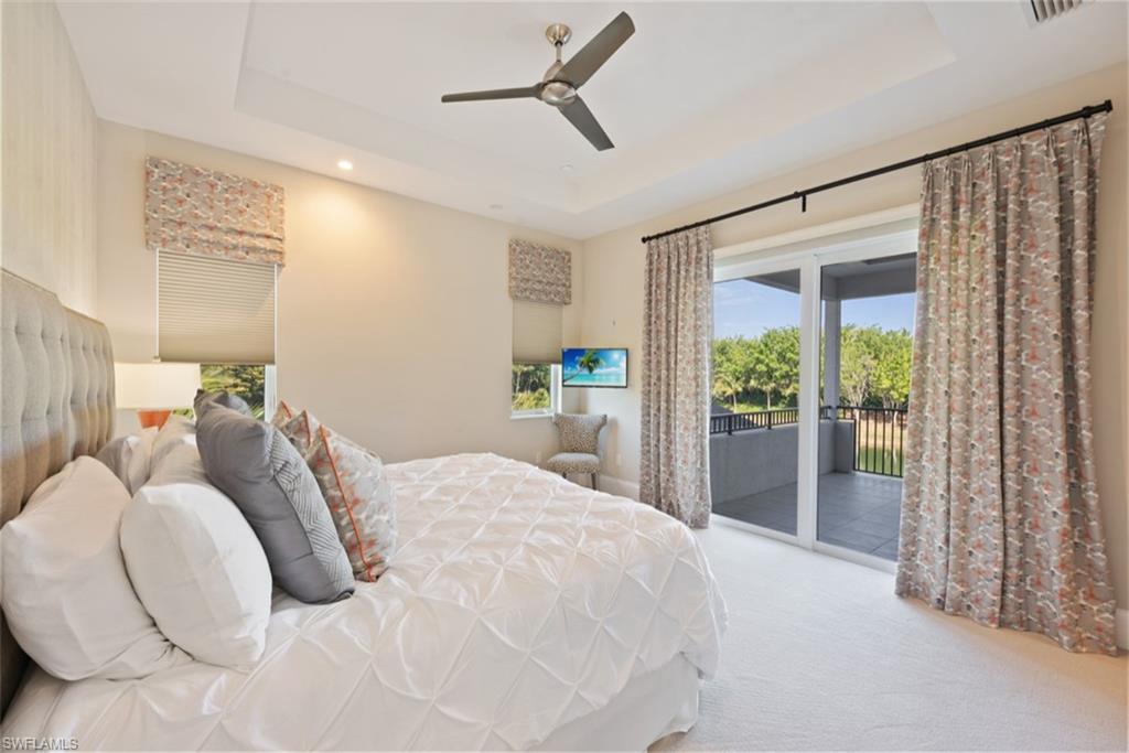 11910 Via Salerno Way Miromar Lakes, FL 33913 - Photo 29 of 50 a large bed sitting in a bedroom next to a window