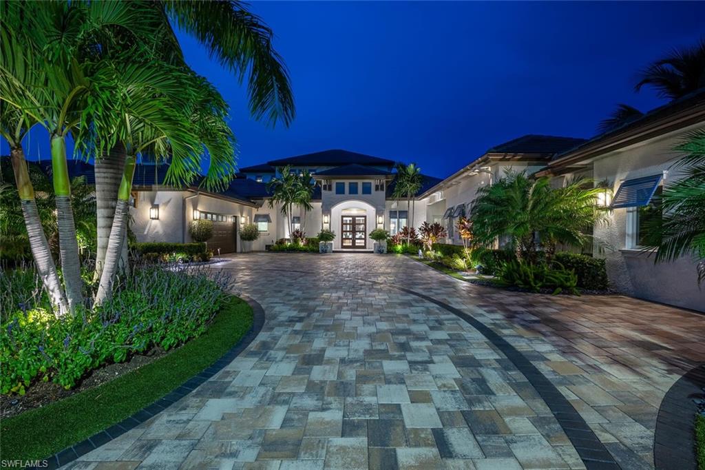 11910 Via Salerno Way Miromar Lakes, FL 33913 - Photo 37 of 50 a view of a yard with an umbrella