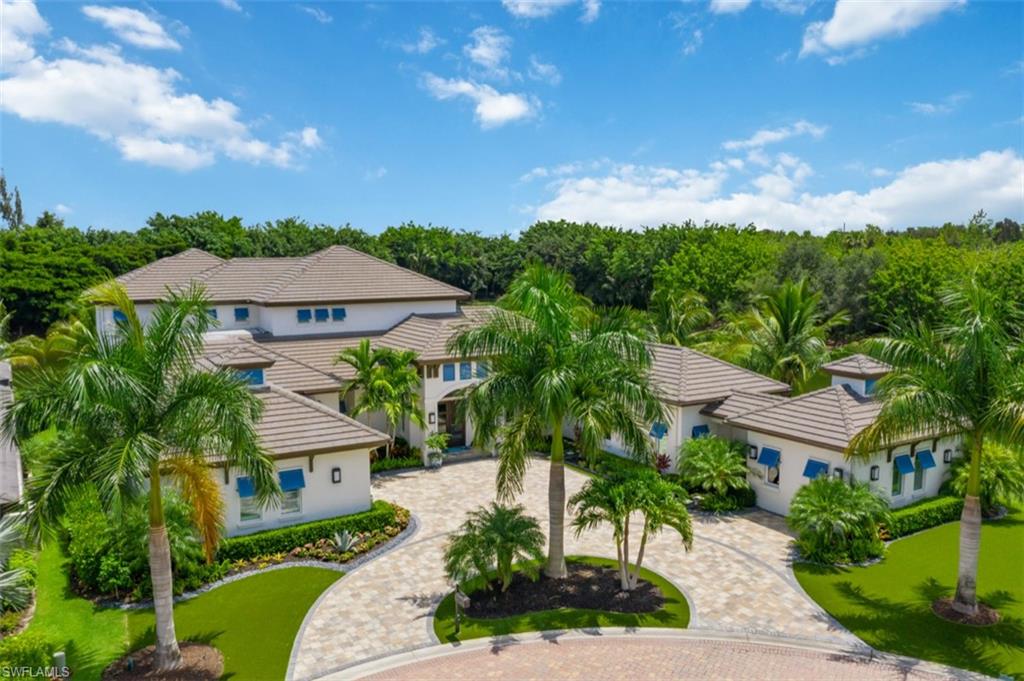 11910 Via Salerno Way Miromar Lakes, FL 33913 - Photo 40 of 50 a view of a garden with a house