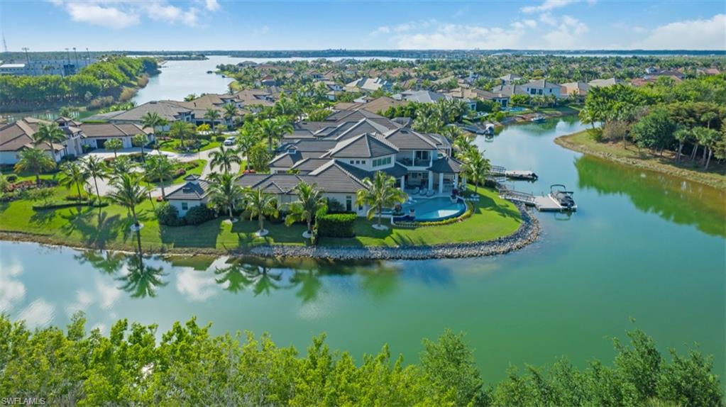 11910 Via Salerno Way Miromar Lakes, FL 33913 - Photo 41 of 50 an aerial view of residential houses with outdoor space and lake view