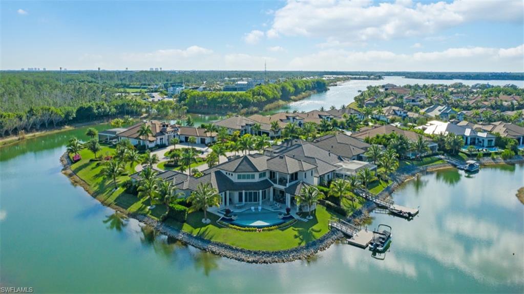 11910 Via Salerno Way Miromar Lakes, FL 33913 - Photo 42 of 50 a view of a lake with a mountain in the back