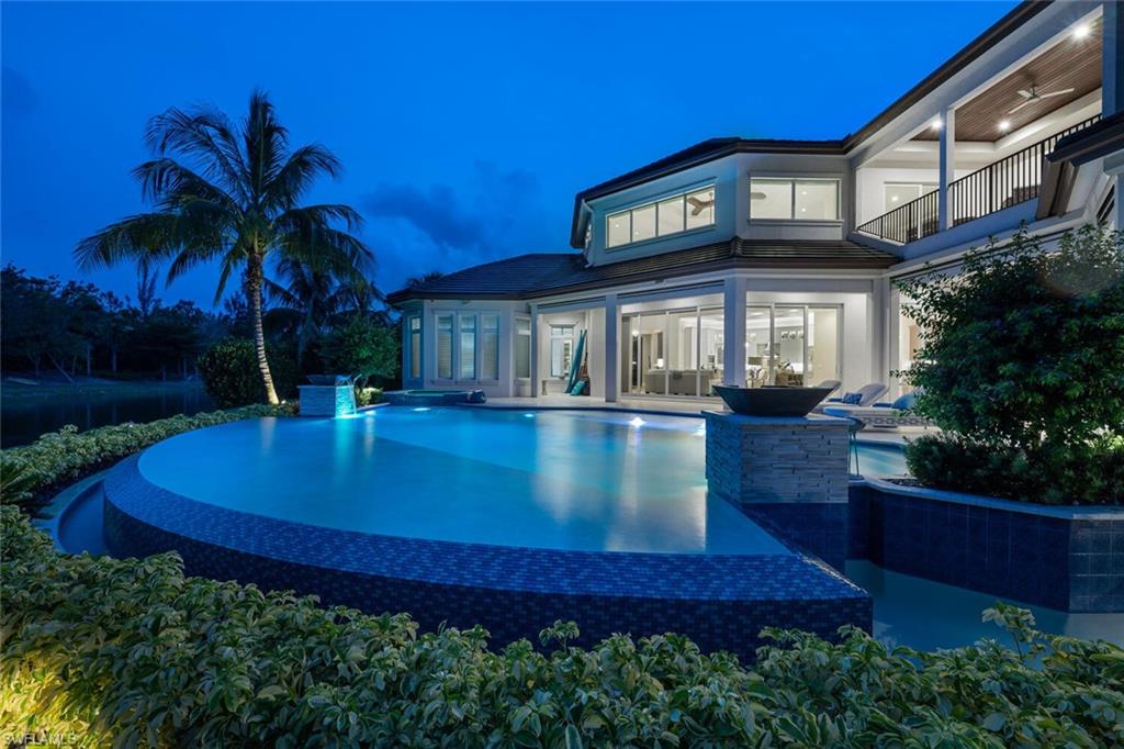 11910 Via Salerno Way Miromar Lakes, FL 33913 - Photo 5 of 50 a view of a building with a swimming pool