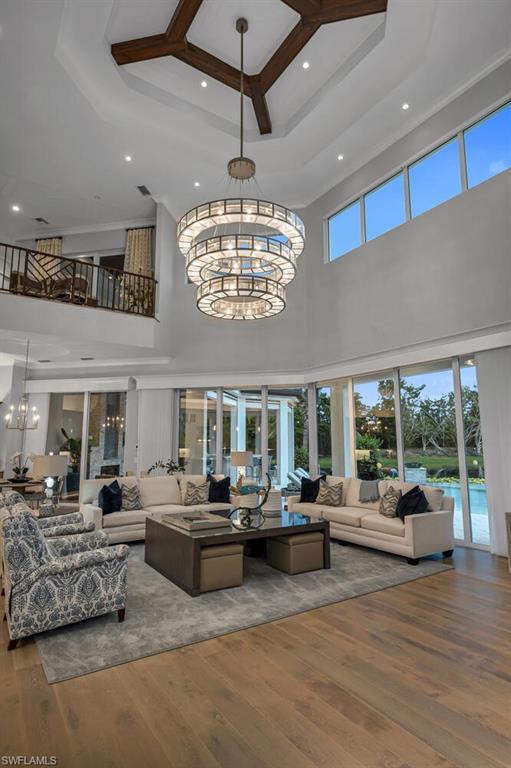 11910 Via Salerno Way Miromar Lakes, FL 33913 - Photo 9 of 50 a living room with furniture kitchen view and large windows