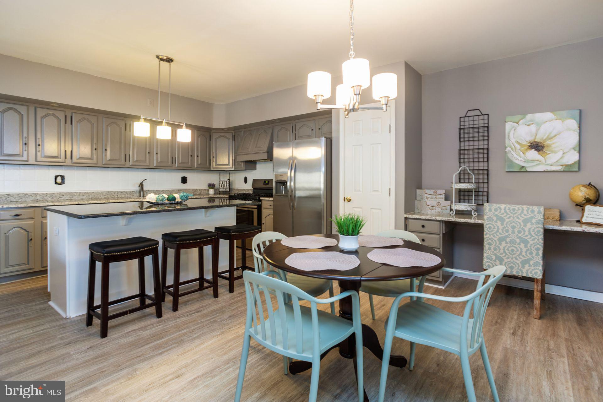 723 Tasker Street Philadelphia, PA 19148 - Photo 9 of 33 Renovated Kitchen with Island, desk area