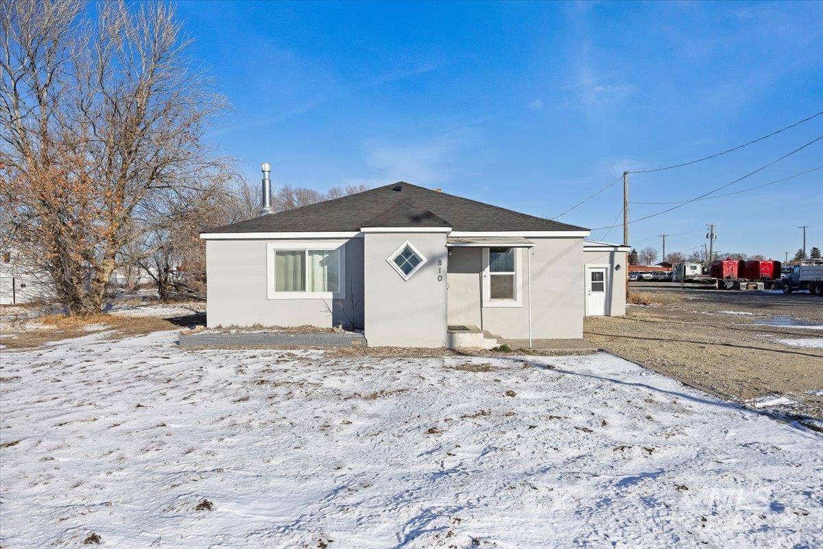 810 South 9th Street Rupert, ID 83350 - Photo 1 of 31 Bungalow-style house featuring stucco siding and a shingled roof