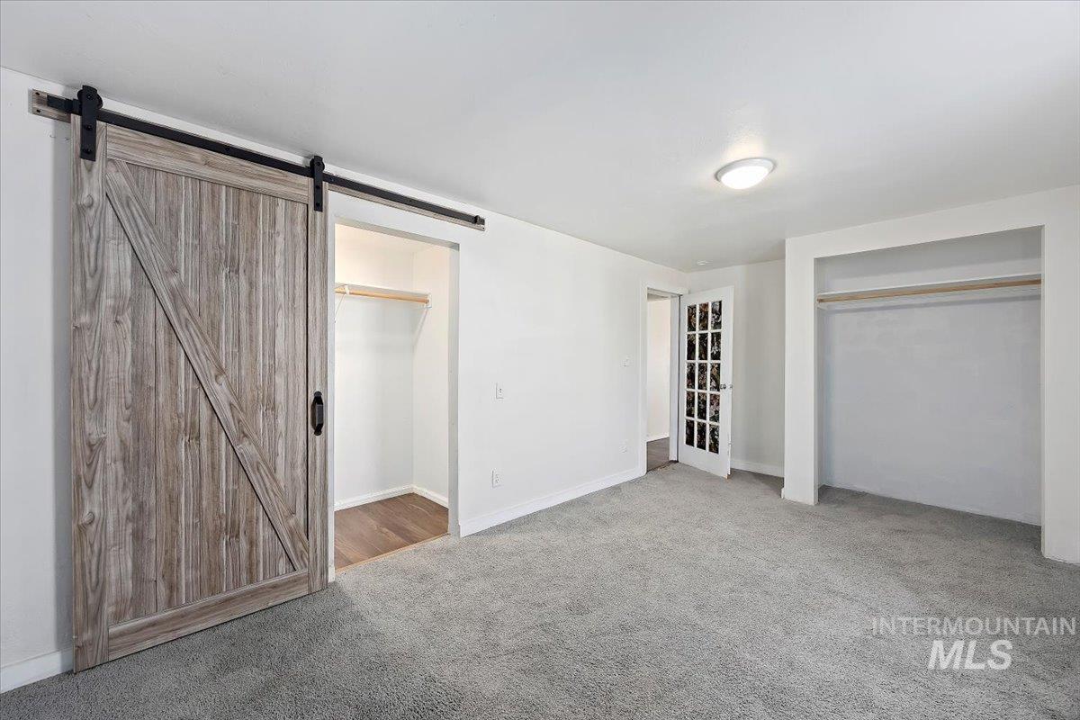 810 South 9th Street Rupert, ID 83350 - Photo 18 of 31 Unfurnished bedroom with carpet and a closet