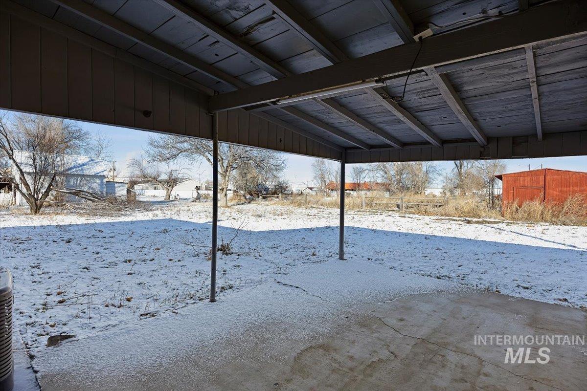 810 South 9th Street Rupert, ID 83350 - Photo 25 of 31 Yard layered in snow with a patio