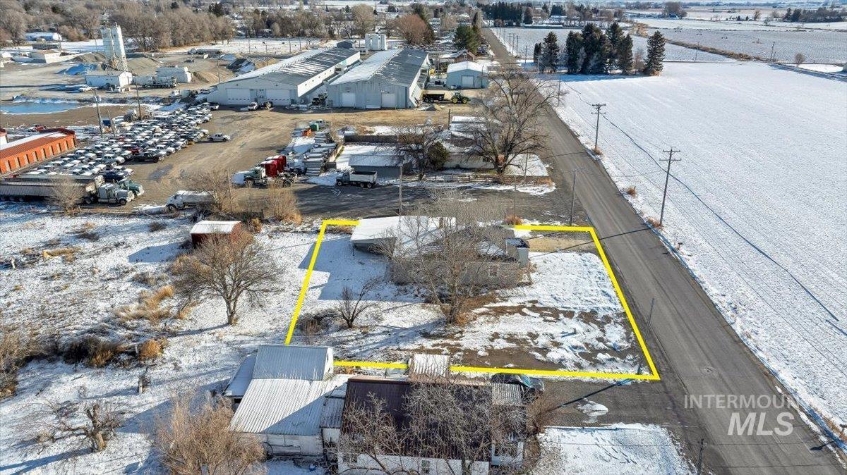 810 South 9th Street Rupert, ID 83350 - Photo 28 of 31 Snowy aerial view featuring property boundaries highlighted