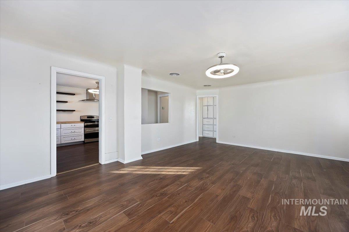 810 South 9th Street Rupert, ID 83350 - Photo 8 of 31 Spare room featuring dark wood-type flooring