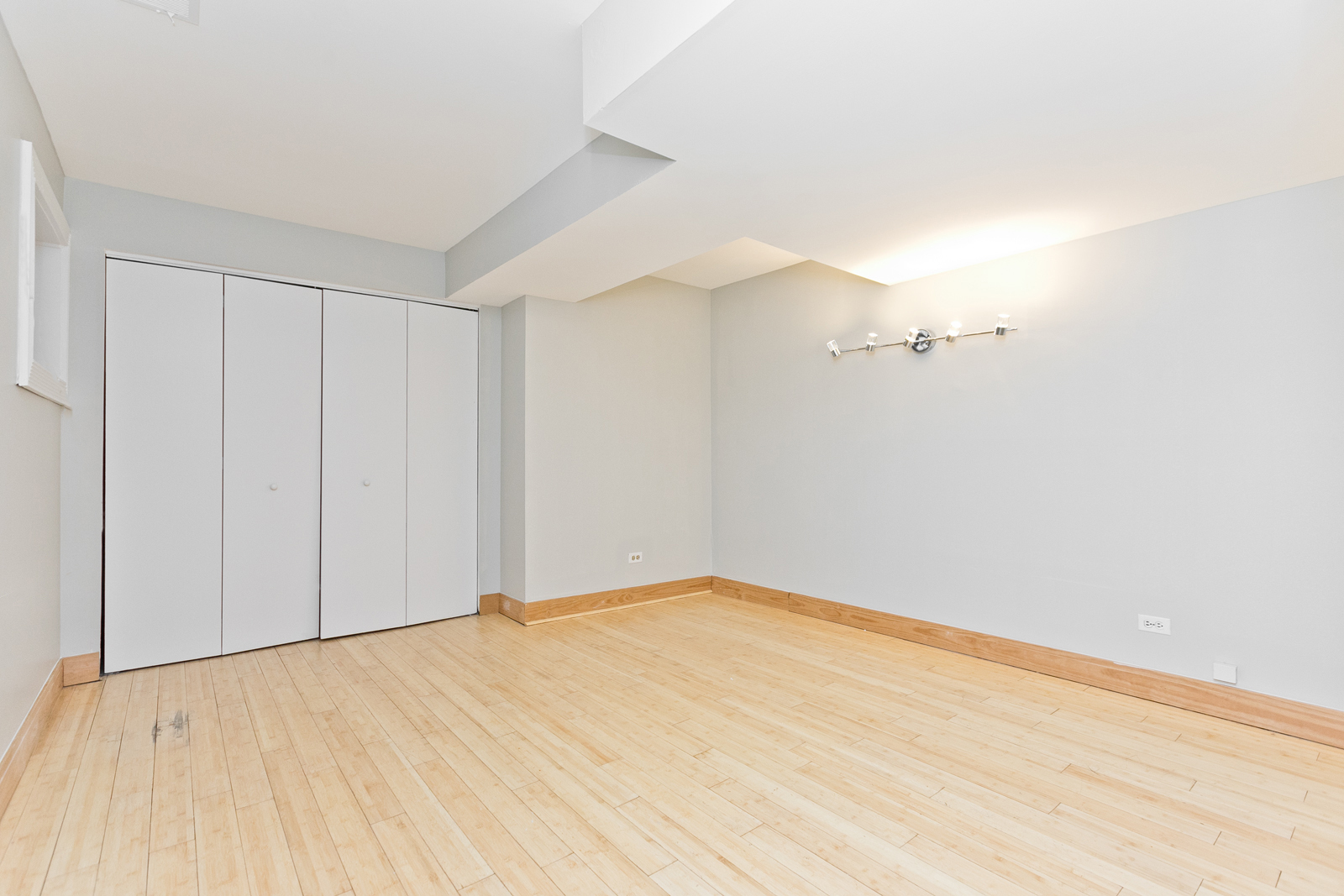 4061 North Sheridan Road, Unit G Chicago, IL 60613 - Photo 8 of 10 a view of empty room with wooden floor